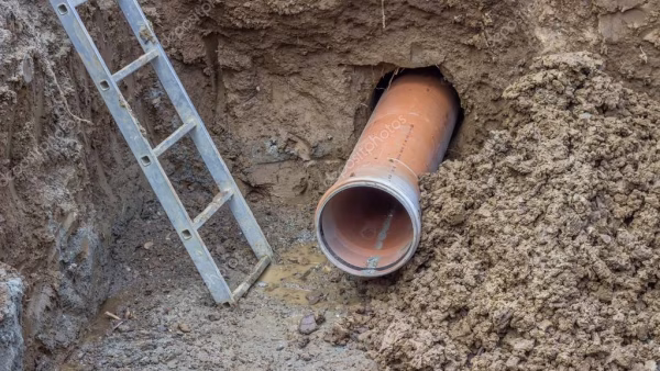 depositphotos_53471871-stock-photo-installing-pipes-under-the-road